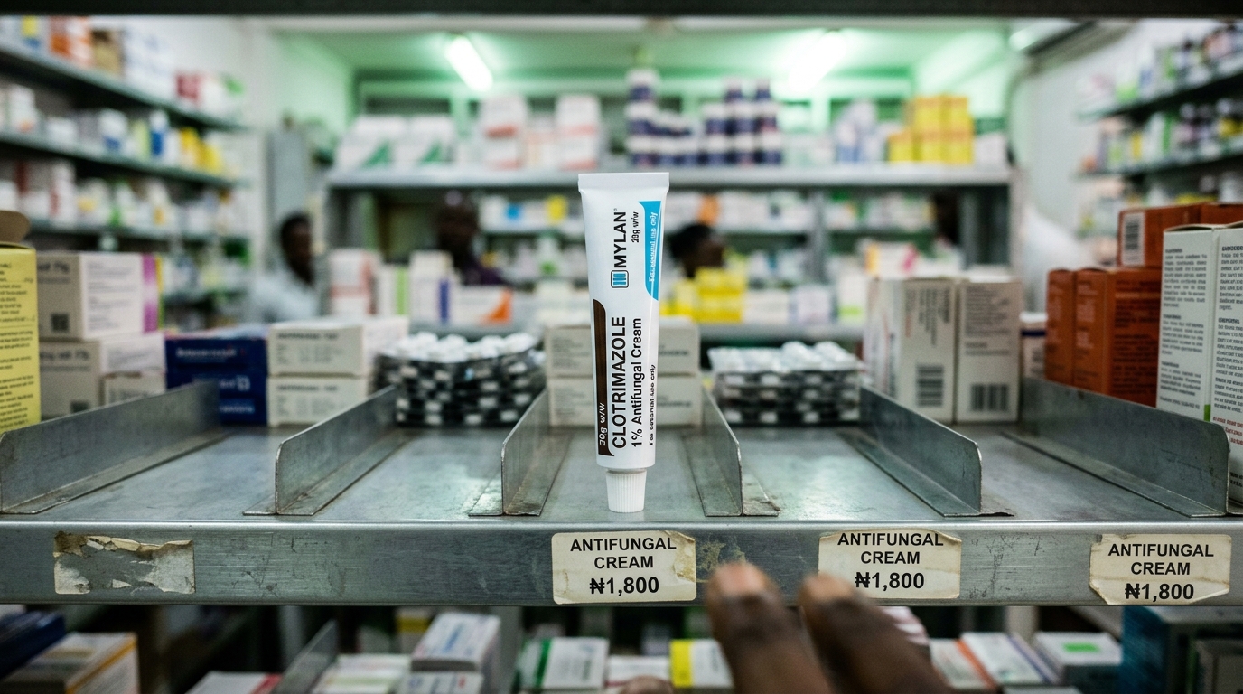 Hand reaching for antifungal cream on pharmacy shelf
